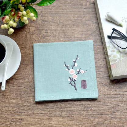 Green Chinese handkerchief with the pattern of plum blossom