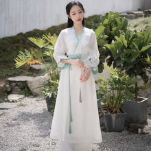 Load image into Gallery viewer, A woman with a white modern hanfu dress with green waistband
