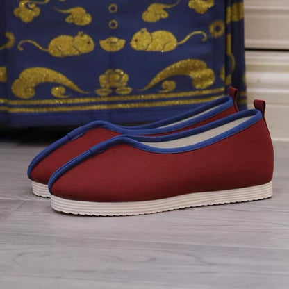 Wine red traditional Chinese shoes for women in Qing dynasty with blue rim